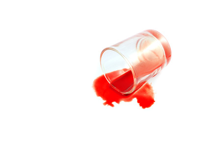 bleeding blood in the glass on white background / concept of the scientific experiment disease bloodの写真素材