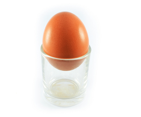 fresh eggs in glass isolated on white backgroundの写真素材