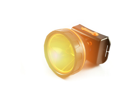 headlamp flashlight isolated With orange lights / black torch light on white background