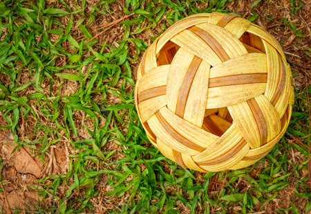 Sepak Takraw ball - rattan ball sport outdoor / Sepak takraw on green grass fieldの写真素材