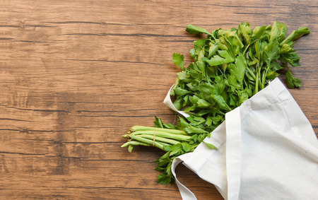 Zero waste use less plastic concept / Fresh vegetables organic in eco cotton fabric bags on wooden...