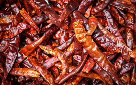 Pile of red dried chilli dry pepper texture backgroundの写真素材