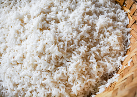 Raw sticky rice white in steamer bamboo for cook steamed foodの写真素材