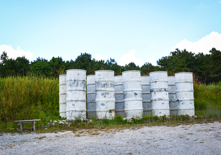 Storage water tank concrete cement on hill and meadow backgroundの写真素材