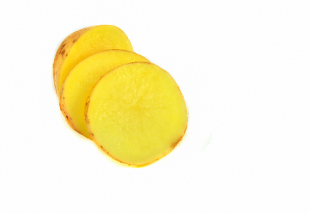 Fresh organic potato slice isolated on white backgroundの写真素材