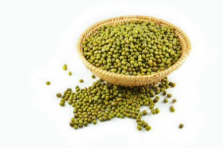 Mung beans seed cereal whole grains in the basket and isolated on white backgroundの写真素材