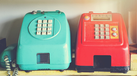 Retro telephone / old phone landline on wood table in officeの写真素材