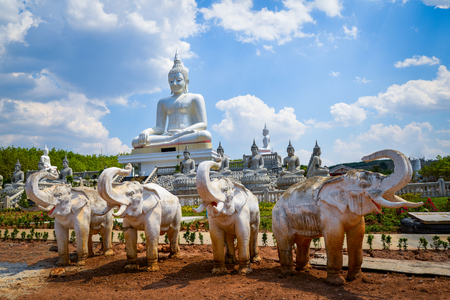 Landscape beautiful buddha statue and elephant statue on outdoors nature cloud blue sky backgroundの写真素材