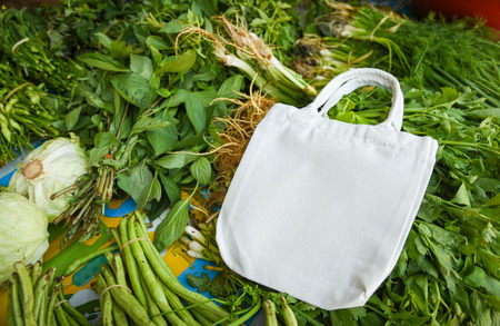 Zero waste use less plastic concept / Fresh vegetables organic and eco cotton fabric bags - white tote canvas cloth bag  in market free plastic shoppingの写真素材