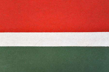 Green and red floor colorful painted on court sport outdoors with white line backgroundの写真素材