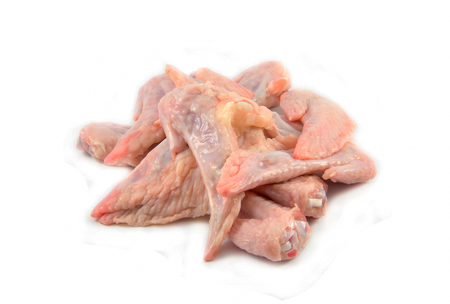 Fresh raw chicken wings isolated on white backgroundの写真素材