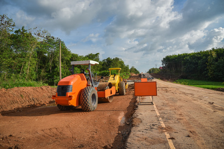 Road roller working at road construction site