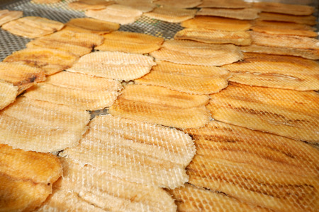 Dried banana fruit organic making dry on net with sunlightの写真素材