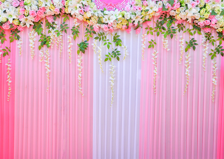 Backdrop wedding background romantic flower and green leaf decoration plant beautiful pink curtainの写真素材