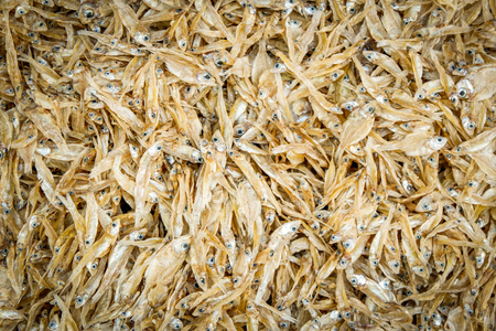 Dried small fish for fried crispy texture background  food in asianの写真素材