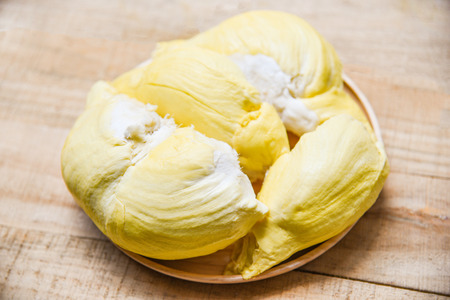 Durian riped / Fresh durian peel tropical fruit summer on wooden tray background