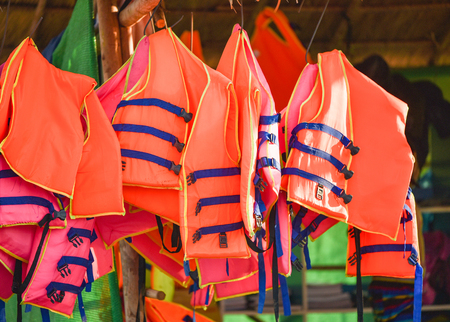 Life jacket safety equipment on bamboo railの写真素材