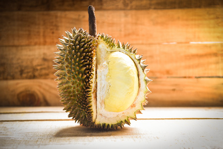 Durian riped / Fresh durian peel tropical fruit on wooden background on summerの写真素材