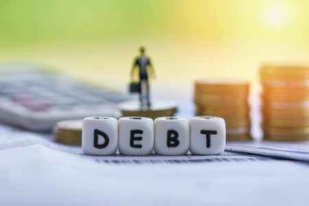 Debt credit card and money coin stack / Increased liabilities from exemption debt consolidation concept of financial crisis and problems risk business management loan interestの写真素材