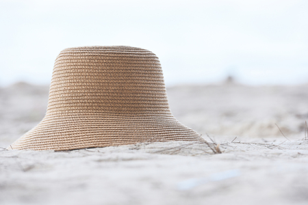 hat summer / straw hat fasion and on sandy beach sea backgroundの写真素材