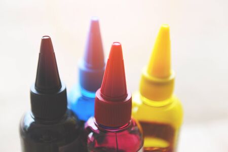 CMYK ink bottle for printer machine / Colorful Ink refill set with cyan blue red magenta yellow and black for printer inks tankの写真素材