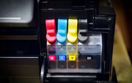printer ink tank for refill at office / Close up printer cartridge inkjet of color black CMYK ,...