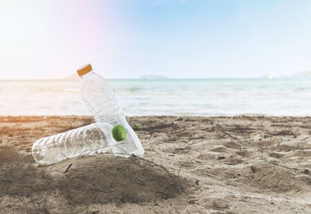 Garbage in the sea with plastic bottle on beach sandy dirty sea on the island / Environmental problem of plastic rubbish pollution in oceanの写真素材