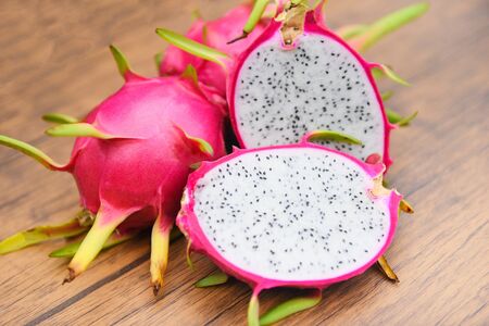 Dragon fruit slice on wooden background / Fresh pitaya summer tropical fruit conceptの写真素材