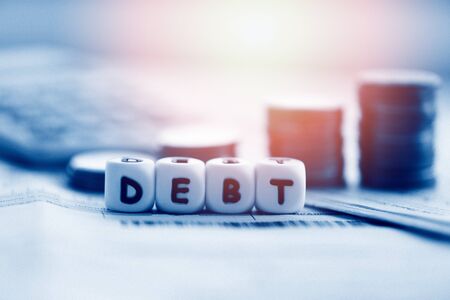 Debt credit card and money coin stack / Increased liabilities from exemption debt consolidation...