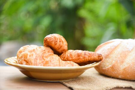 freshly baked croissants / Bakery bread on sack in the table homemade breakfast food concept