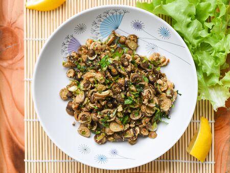 Puff Ball Mushrooms salad spicy with herb and spices on plate lettuce vegetable on table Thai Asian food , selective focusの写真素材