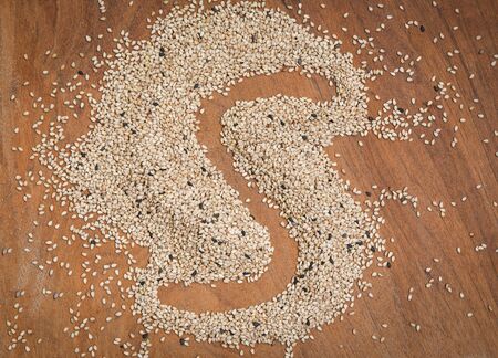 sesame seeds on a wooden background , top view copy spaceの写真素材