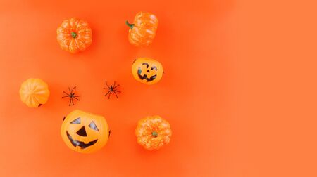 halloween background orange decorated holidays festive concept / spider and jack o lantern pumpkin halloween decorations for party accessories object , top view aerial image flat lay copy spaceの写真素材