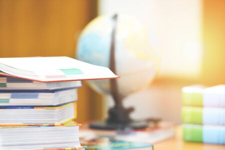 Education concept back to school and business study global world / open book in library with book stacked and earth globe model mapの写真素材
