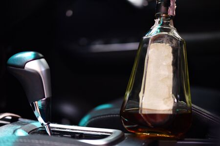 drunk driver concept / alcohol bottle in seats and drive drink alcohol in carの写真素材