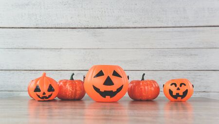 halloween background decorated holidays festive concept / jack o lantern pumpkin halloween decorations on white wooden background for party accessories objectの写真素材