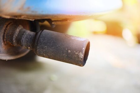 Exhaust pipe on old car close up / Car pollution conceptの写真素材
