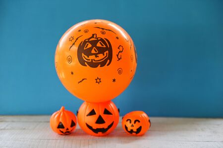holidays decoration and party concept Halloween background decorated  festive on jack o lantern pumpkin / orange balloons halloween decorations accessories object on blueの写真素材