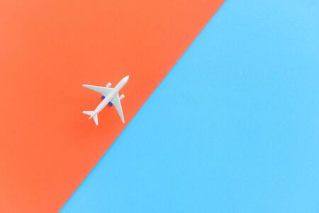 Travel background concept / Airplane Traveler's fly with airliner on blue and orange , top viewの写真素材
