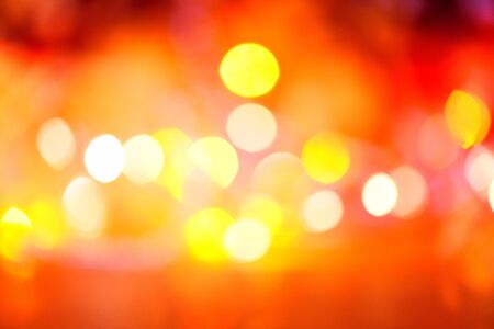 christmas lights orange yellow and red / lights bokeh abstract background multicolored christmas decorate new year conceptの写真素材