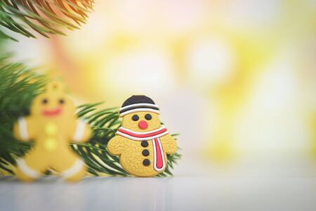 Christmas decoration with snowman and ginger bread light gold abstract holiday background /...