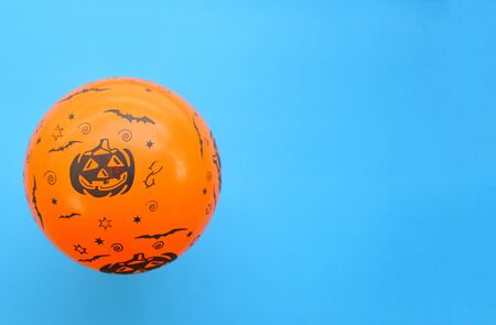 holidays decoration and party concept Halloween background decorated  festive / orange balloons halloween decorations accessories object on blueの写真素材