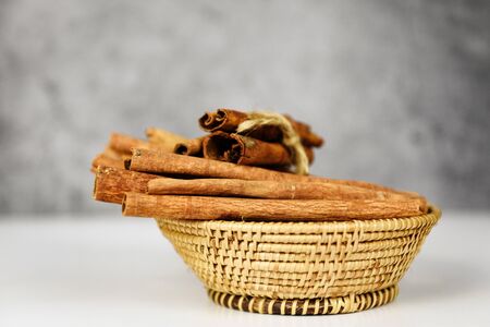 Cinnamon sticks on basket herbs and spices for cooked food