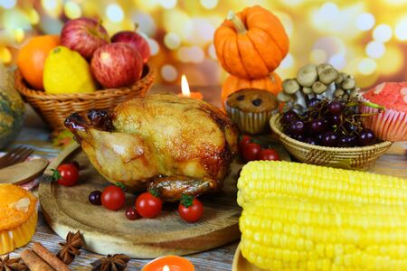 Thanksgiving dinner with turkey vegetable fruit served on holiday thanksgiving table Celebration...
