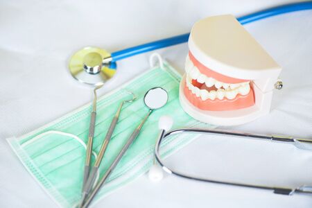 dentist tools with bamboo toothbrush dentures dentistry instruments and dental hygienist checkup...