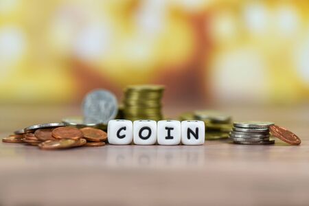 Pile of Golden coin, silver coin and copper coins on table money financial concept 