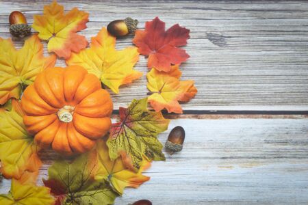 Thanksgiving background frame autumn leaf decoration festive on wooden / Autumn table setting with...