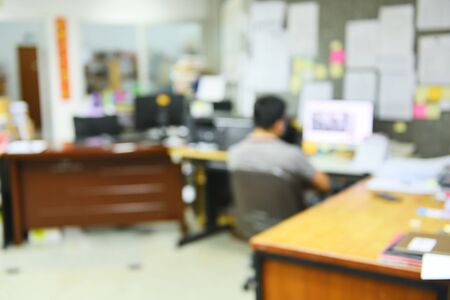 Blurred Image of man is working office desk