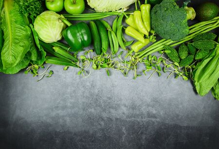 Healthy food selection clean eating for heart life cholesterol diet health concept Fresh green fruit and green vegetables mixed background, vegetable market harvesting agricultural productsの写真素材