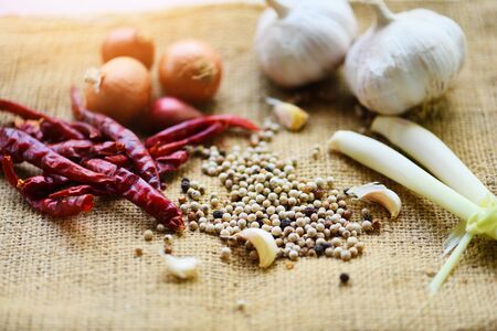 herbs and spices ingredients spicy for Tom Yum thai with lemon grass garlic dried chilli Shallot and pepper seed , Thai Food Asian on sackの写真素材